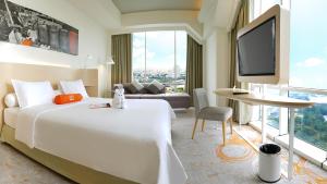 Katil atau katil-katil dalam bilik di HARRIS Suites fx Sudirman
