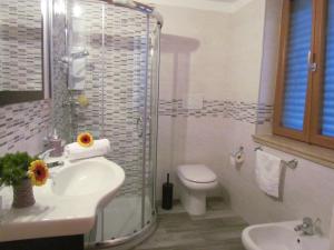 a bathroom with a sink and a toilet and a shower at B&B Eco Dal Mare in Gallipoli +57 photos