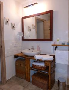 a bathroom with a sink and a mirror at Casa Rural Villa Huerta in Santa María de Huerta +21 photos