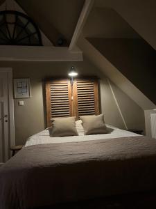 Giường trong phòng chung tại B&B Le flaneur