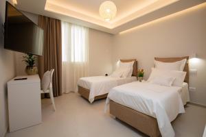 Letto o letti in una camera di Scirocco Boutique Eco Hotel
