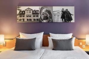 Voodi või voodid majutusasutuse Leonardo Hotel Weimar toas