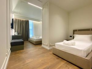 Postel nebo postele na pokoji v ubytování Adore Boutique Hotel