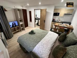 a bedroom with a bed and a living room at Le paradize in Niort