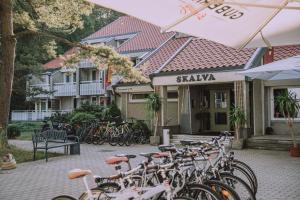 a group of bikes parked in front of a building at Skalva Nida in Nida