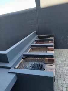 a set of stairs on a building with a drain at Millennial Arch in Langebaan