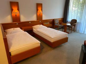 Postel nebo postele na pokoji v ubytování Adamidis Hotel