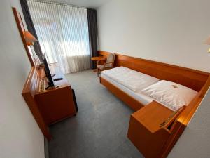 Postel nebo postele na pokoji v ubytování Adamidis Hotel