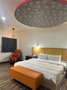 Postel nebo postele na pokoji v ubytování Hua Du Motel