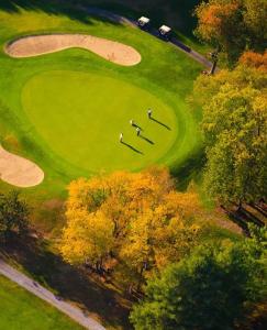 a group of people standing on a golf course at Mijaa pueblo Paradise villa anex in Mijas