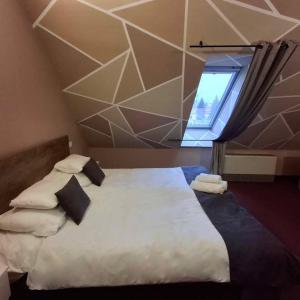 Postel nebo postele na pokoji v ubytování Hotel Unicornis