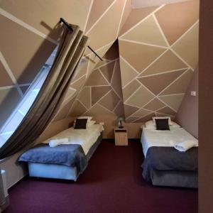 Postel nebo postele na pokoji v ubytování Hotel Unicornis + 37 fotografií
