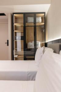 Postel nebo postele na pokoji v ubytování Sasso Hotel