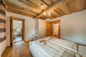 Posteľ alebo postele v izbe v ubytovaní Dachstein Chalet Goisern