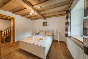 Posteľ alebo postele v izbe v ubytovaní Dachstein Chalet Goisern
