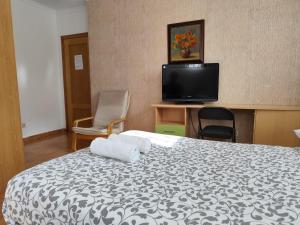 TV a/nebo společenská místnost v ubytování Apartamento y Habitaciones El Colmenar