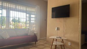 Телевизор и/или развлекательный центр в Casa Veraneio próximo a lagoa