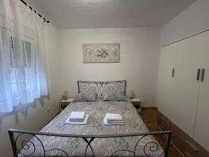 Posteľ alebo postele v izbe v ubytovaní Apartman Petra