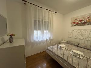 Posteľ alebo postele v izbe v ubytovaní Apartman Petra