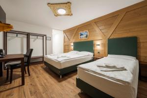 Postel nebo postele na pokoji v ubytování Nord Hotel
