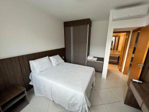 Ένα ή περισσότερα κρεβάτια σε δωμάτιο στο Flat dentro do Parque do Peão de Barretos +4 φωτογραφίες