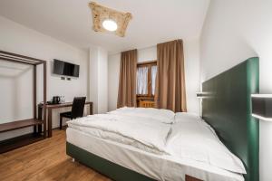 Postel nebo postele na pokoji v ubytování Nord Hotel