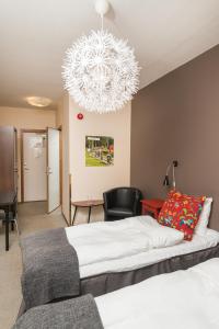 Postelja oz. postelje v sobi nastanitve Hotell Fridhemsgatan