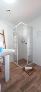 a bathroom with a shower and a sink and a table at Quinta do Ti Vasco in Pedrógão Grande +48 photos