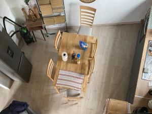 an overhead view of a dining room table and chairs at Villa bienvenue in Bras des Calumets +6 photos