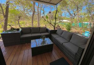 a living room with a couch and a table at Casa Eden in Tamarindo