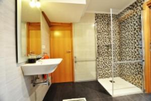 Ein Badezimmer in der Unterkunft Orio Apartments