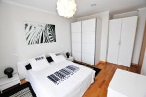 Ein Bett oder Betten in einem Zimmer der Unterkunft Orio Apartments