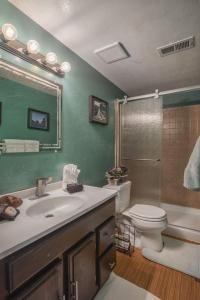 a bathroom with a sink and a toilet and a shower at 5 bedroom, 3 bath - Sleeps 12, Great for Families in Boulder +35 photos