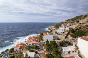 an aerial view of a village with the ocean at Casa del Sol in Kouniádhoi