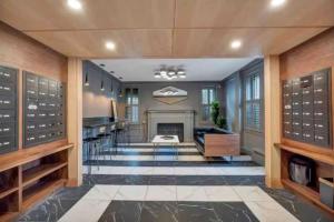 a large room with a fireplace and a dining room at Chateau Blanc Yale Located Downtown in New Haven