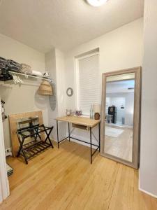 a room with a mirror and a table and a mirror at Yale Casa Azul Studio in New Haven