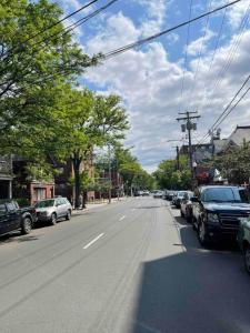 a street with cars parked on the side of the road at Yale Casa Azul Studio in New Haven