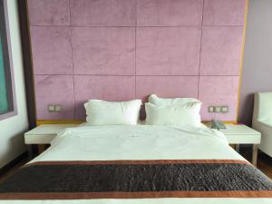 Postelja oz. postelje v sobi nastanitve Meritz Hotel
