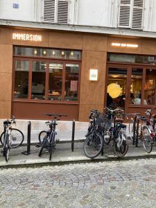 a group of bikes parked in front of a store at Historic paris charme in Paris