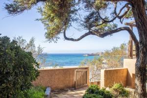 a view of the ocean from a house at Villa Meridiana in Isola Rossa