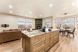 a kitchen and living room with a couch and a table at Troutner East Boise Home in Boise