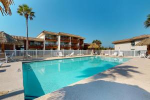 a large swimming pool in front of a hotel at Oceans 11th in Port Aransas
