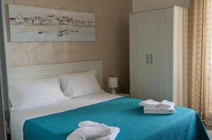 Postel nebo postele na pokoji v ubytování B&B Benvenuti al Sud