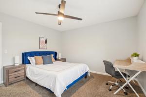 a bedroom with a blue bed and a desk at Brentwood U5 I Cozy & Comfy I 2bd I Free Parking in Nashville +26 photos