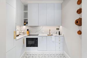 Kuchyň nebo kuchyňský kout v ubytování Vodickova Luxury Suites