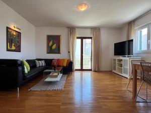 Televízia a/alebo spoločenská miestnosť v ubytovaní Apartment BEPPO