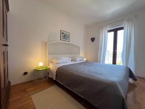 Posteľ alebo postele v izbe v ubytovaní Apartment BEPPO