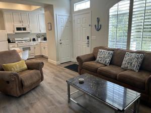 a living room with two couches and a coffee table at 444 Pier Avenue #510 in Oceano