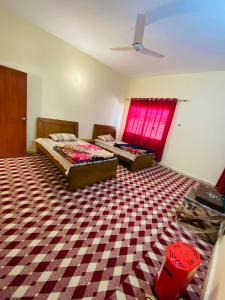 Postel nebo postele na pokoji v ubytování KK Sha Inn