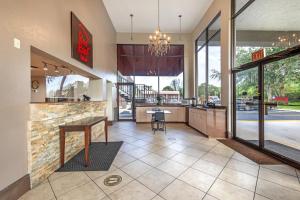 a restaurant lobby with a counter and a table at Red Roof Inn Ft Pierce in Fort Pierce